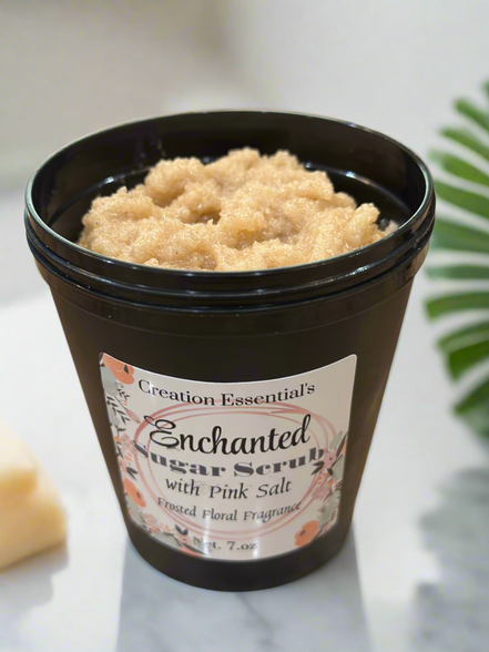 Jar of Enchanted Sugar Scrub with Pink Salt on a marble surface
