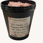 Creation Essential's Good Morning Cafe creamy body scrub with coffee beans and organic sugar in a black jar