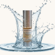 Creation Essential's Natural Body Radiance Hyaluronic Facial Toner bottle surrounded by a refreshing water splash.