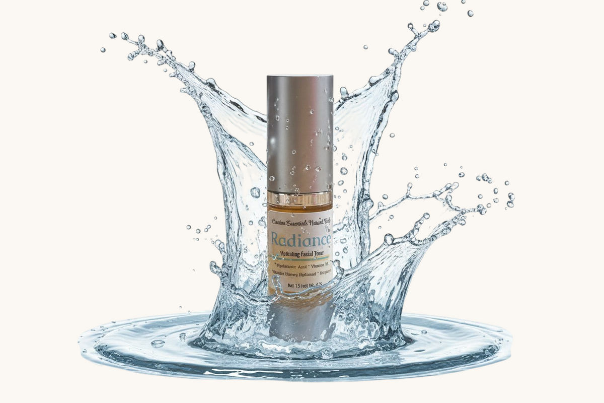 Creation Essential's Natural Body Radiance Hyaluronic Facial Toner bottle surrounded by a refreshing water splash.