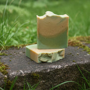 Green soap bar on a granite countertop