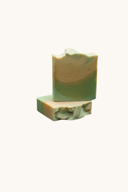 Green soap bar on a granite countertop