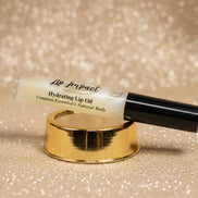 Lip Impact hydrating lip oil on a white background