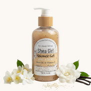 A bottle of Shea Girl Vanilla Dream Body Wash on a textured surface with a bright, outdoor background.