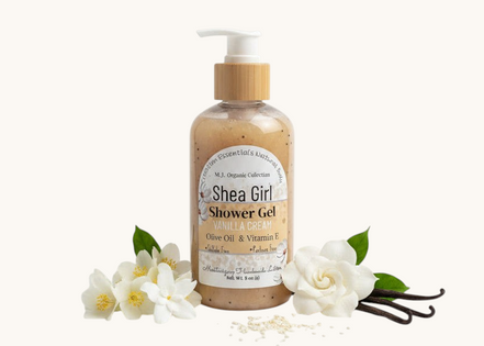 A bottle of Shea Girl Vanilla Dream Body Wash on a textured surface with a bright, outdoor background.