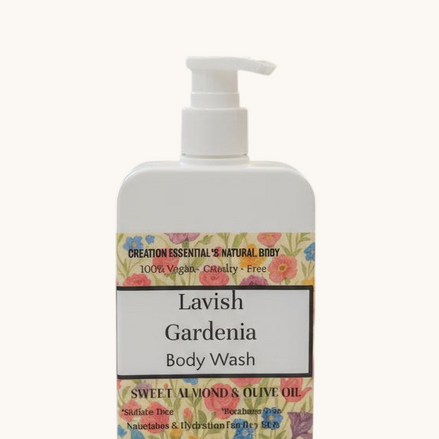 Creation Essential's Natural Body Lavish Gardenia body wash in a white pump bottle with a floral label.