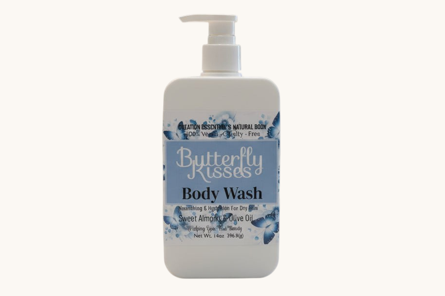 Butterfly Kisses body wash bottle on a bathroom counter with a blurred background