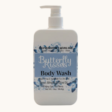 Butterfly Kisses body wash bottle on a bathroom counter with a blurred background