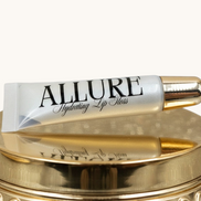 Allure lip balm tube on a beige background