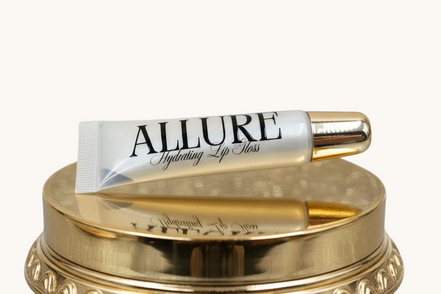 Allure lip balm tube on a beige background