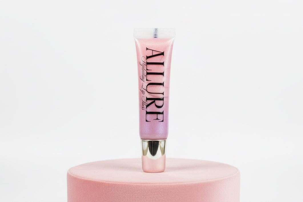 Pink lip gloss tube with 'Allure' branding on a pink stand against a white background