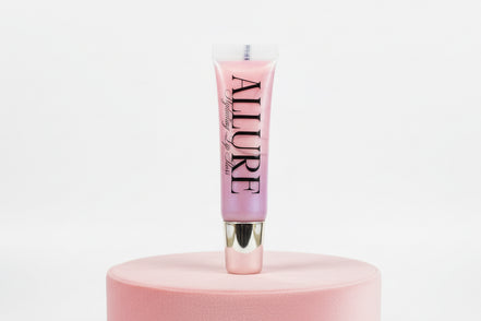 Pink lip gloss tube with 'Allure' branding on a pink stand against a white background