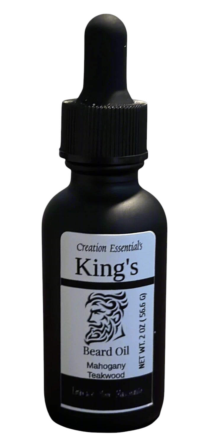 Creation Essential's Natural Body King's Beard Oil in a matte black dropper bottle with mahogany teakwood scent