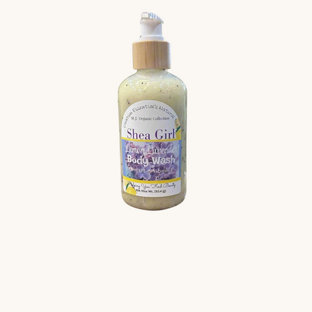 Creation Essential's Natural Body Shea Girl Lemon Lavender body wash in a clear pump bottle on a bathroom ledge.
