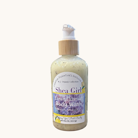 Creation Essential's Natural Body Shea Girl Lemon Lavender body wash in a pump bottle set against a garden background.