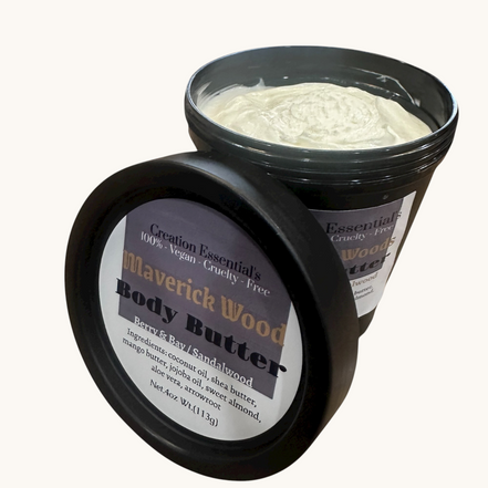 Creation Essential's Natural Body Maverick Woods organic body butter in a black jar with a creamy white texture